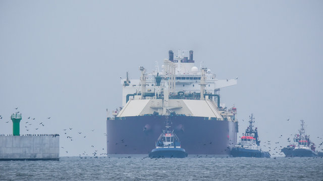 GAS TANKER - A large merchant ship enters the port
