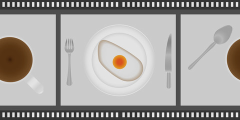 fried eggs and cup of coffee for breakfast on plate, with fork and knife in a cinema lent. Top view