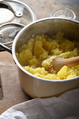 Mashed potato with butter in pot