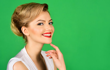 Sexy blonde girl in elegant white dress. Attractive pretty girl in retro style. Smiling girl in white dress, isolated on green background. Valentines day. Copy space for advertise.