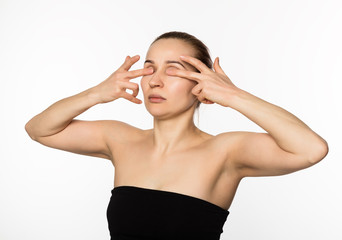 Fototapeta premium beautiful girl performs anti-aging exercises. face fitness for anti sagging skin