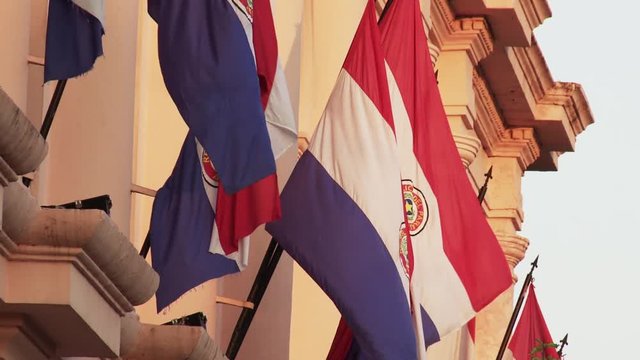 Paraguayan Flags Waving in a Building of Asuncion, Paraguay 