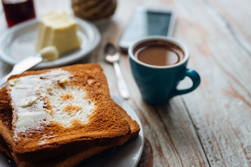 Breakfast of businessman with coffee and phone