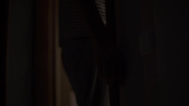 Dad and two sons leave the room and exclude light. Hand close-up on switches.