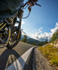 Motorcycle rider driving in Alps