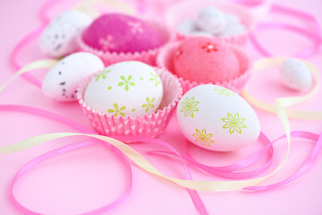 Fototapeta na wymiar Festive background with easter eggs and ribbons