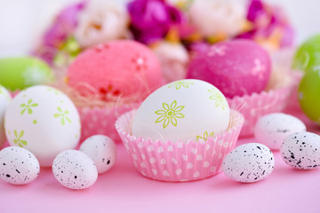 Easter eggs on a pink background. Festive background