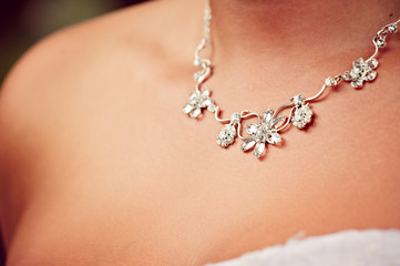 Detail of a wedding necklace on a bride