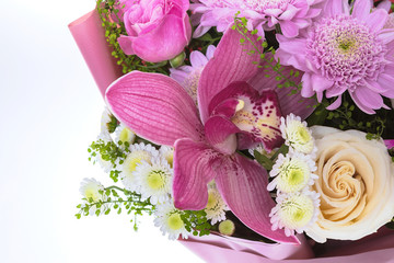 Bright buketny composition from fresh flowers, the white isolated background