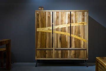 Wooden wardrobe made of different kinds of wood using variorus wood processing technique