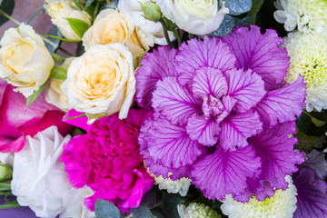 Bright buketny composition from fresh flowers, the white isolated background