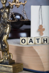 Word OATH composed of wooden letters.