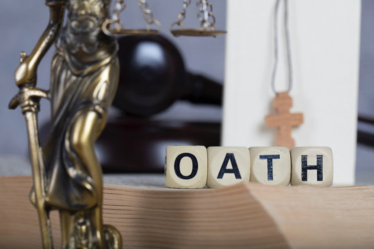 Word OATH composed of wooden letters.