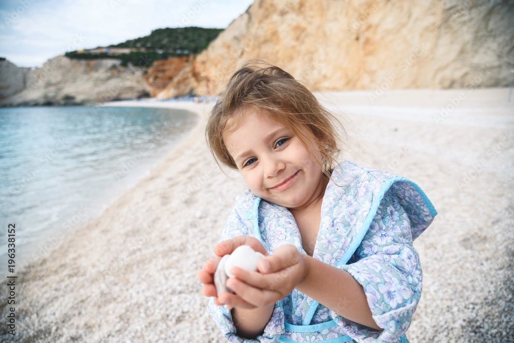 Wall mural Girl Holding Stones