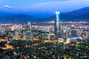 Panoramic view at night of Santiago de Chile with The Andes Mountain Range in the back