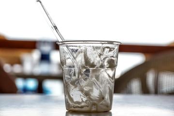 cocktail glass or empty drink is used with drops of foam on a table