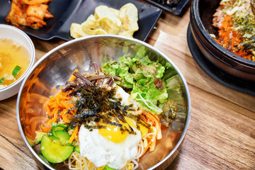 Bibimbap is a popular Korean dish. Mixed rice with meat