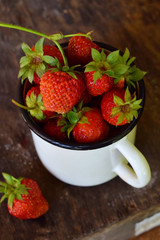 Organic fresh strawberry from garden. Preparation for making berry compote or jam. Homemade conservation for the winter. Raw food. Copy space.