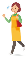 A middle-aged housewife wearing an apron  is  running with bag