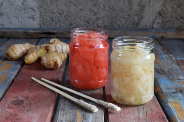 Pickled ginger slices and wooden chopsticks. Ingredient for sushi. Healthy food. Traditional Japanese condiment.
