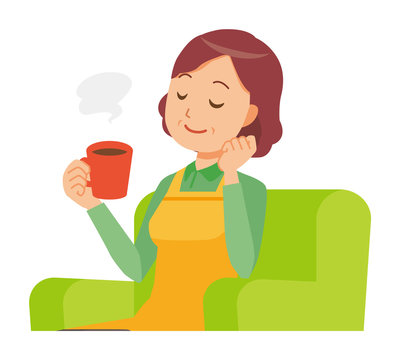 A middle-aged housewife wearing an apron is sitting on a sofa and drinking coffee