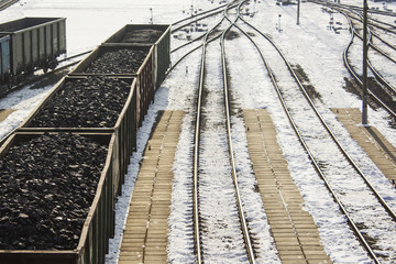 Fototapeta premium rail cars loaded with coal, a train transports coal