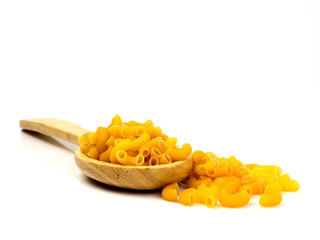 row macaroni in big wood spoon on white background isolated