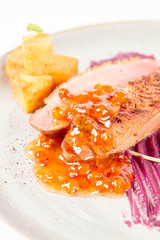 Roast duck breast, red cabbage with apple, roasted potatoes,mountain ash and honey sauce