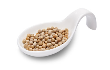 white pepper in white spoon isolated. Spices.