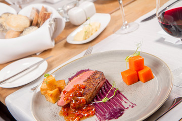 Roast duck breast, red cabbage with apple, roasted potatoes,mountain ash and honey sauce