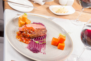 Roast duck breast, red cabbage with apple, roasted potatoes,mountain ash and honey sauce