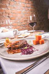 Roast duck breast, red cabbage with apple, roasted potatoes,mountain ash and honey sauce