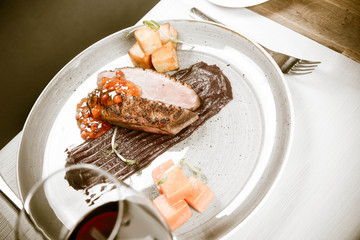 Roast duck breast, red cabbage with apple, roasted potatoes,mountain ash and honey sauce