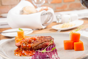 Roast duck breast, red cabbage with apple, roasted potatoes,mountain ash and honey sauce