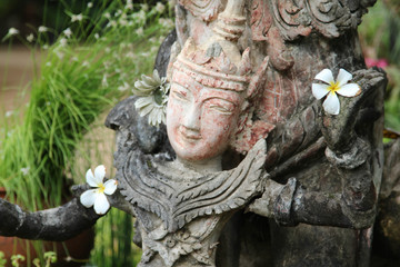 Deva stutue and the leelawadee flower in left hand.