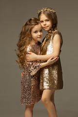The fashion portrait of young beautiful teen girls at studio