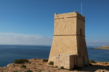 Fototapeta na wymiar Ghajn Tuffieha Tower at Ghajn Tuffieha Bay in Malta