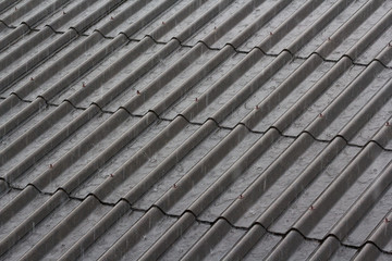 heavy rain drop on house roof. weather forecast. Concept : repair or maintenance roof, install rain gutter before rainy season.