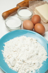 Baking ingredients on white background.