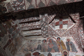 TIGRAY REGION, ETHIOPIA - February 06, 2018: wall murals of saints and iconographic scenes, painted in naive african christian style, on wall of Yohannes Meaquddi church - 196350980