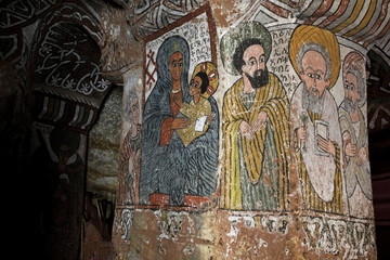 : iconographic scenes and wall murals of saints painted in naive african christian style in Abuna Yemata Guh church  