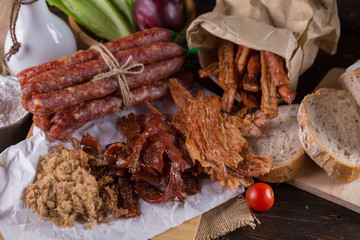 Chinese sausage and Pounded pork jerky for cook on a wooden background