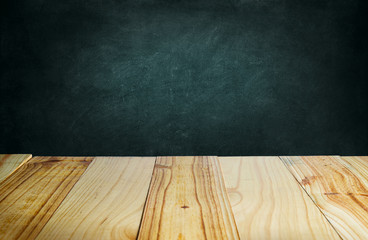 Wood table and blackboard background.
