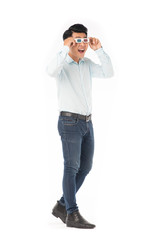 Portrait of young Asian man wearing 3d cinema glasses on white background