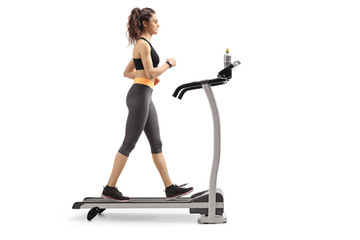 Fitness woman walking on a treadmill