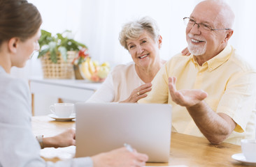 Insurance agent with smiling couple