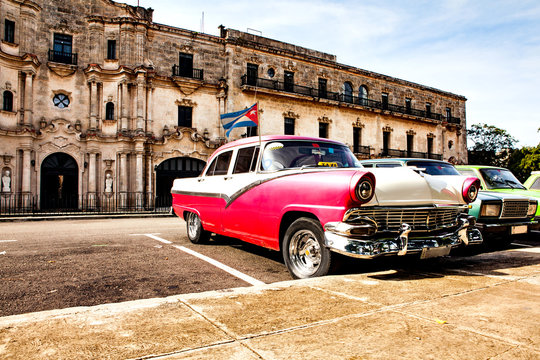 Group of colorful vintage classic cars parked in Old Havana