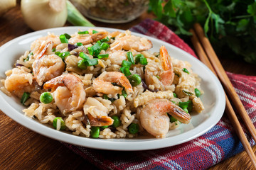 Fried rice with shrimp and vegetables served on a plate