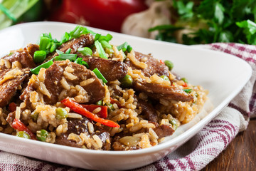 Fried rice with chicken and vegetables served on a plate