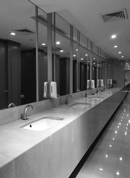 Interior design of public wash basin in modern hotel or restaurant, black and white tone